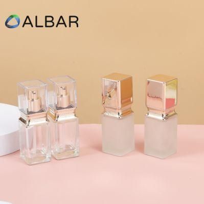 Clear and Gold Cover Rectangle Cosmetic Glass Bottles with Customized Printing Logo