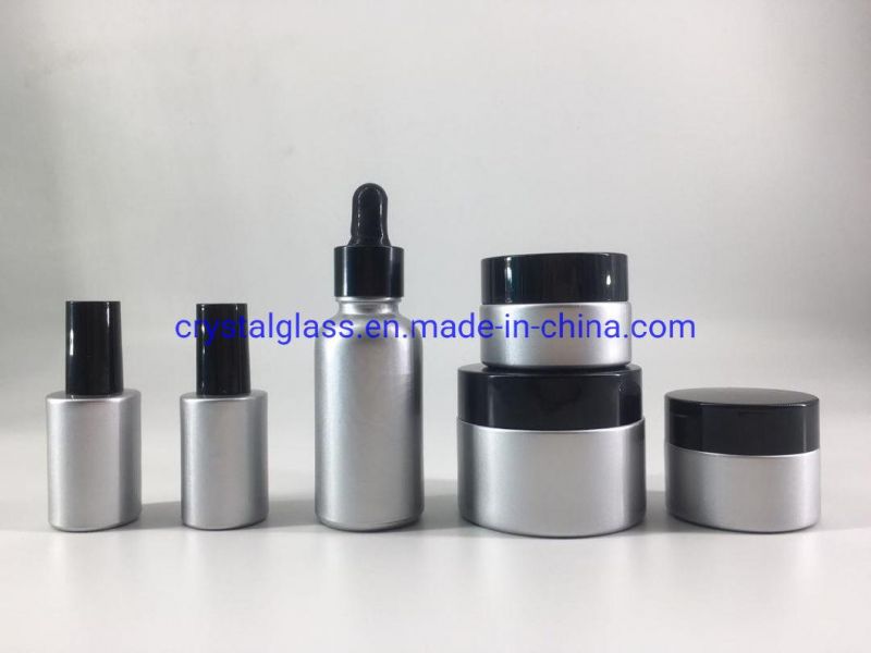 Customized Silver Color Cosmetic Bottle Set with Black Caps