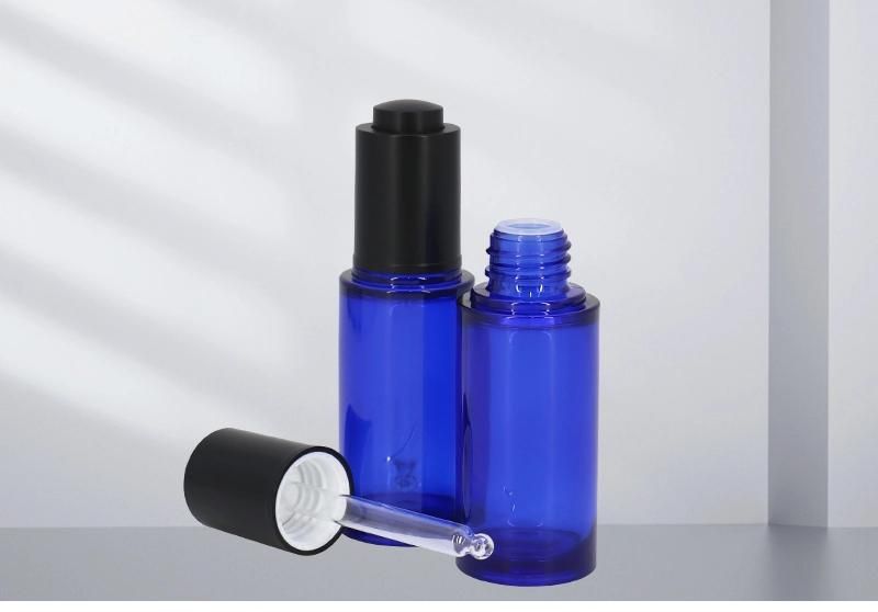 OEM Dark Blue 30ml PETG Round Essential Oil Dropper Bottle with Press Dropper Lotion Pump