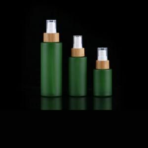 Frosted Green Glass Bottles with Bamboo Lids Spray Glass Bottles