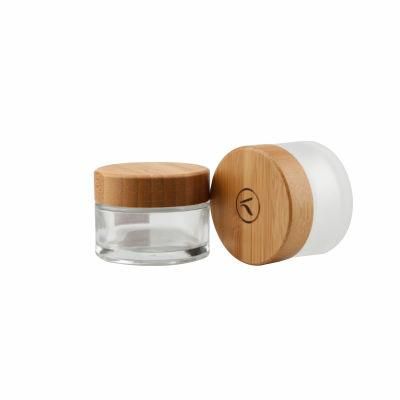 Eco Friendly Custom Logo Glass Cosmetic Jar 30g 50g Clear Frosted Glass Jars with Bamboo Wood Lid