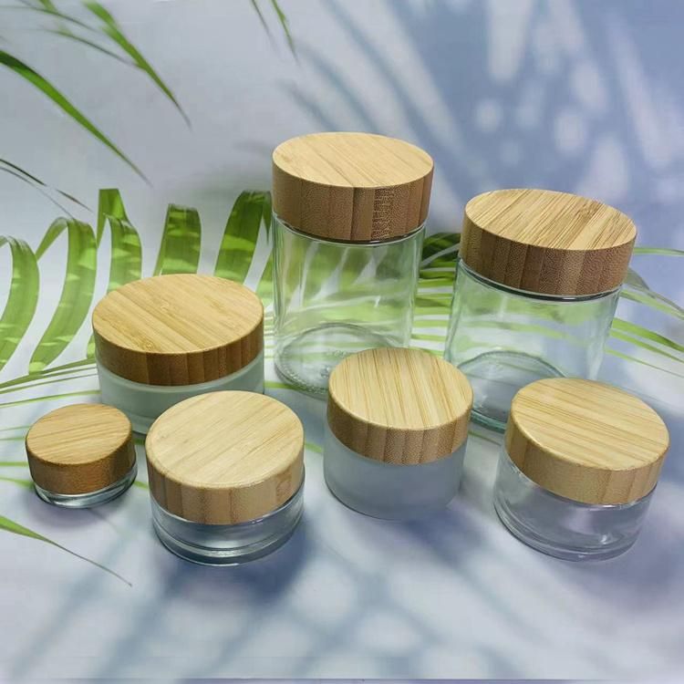 ODM 50g 100g 200g Round Bottle Glass Cosmetic Packaging Bamboo Cap Cream Jar