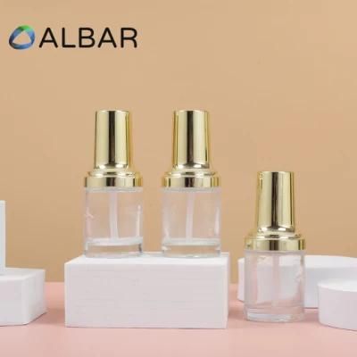 Thick Base Light Gold Fluid Pump Flat Shoulder Short Cylinder Cosmetic Glass Bottles