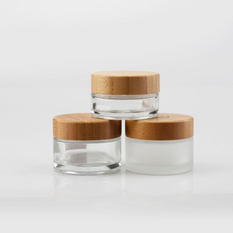 Eco Friendly Custom Logo Glass Cosmetic Jar 30g 50g Clear Frosted Glass Jars with Bamboo Wood Lid