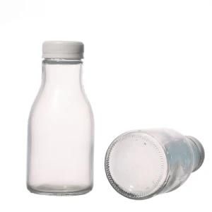 Wholesale 250ml Plastic Lids Round Glass Bottle Clear Customize Glass Milk Bottles Factory