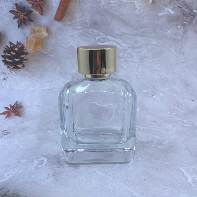 ODM 100ml Gold Stamping Logo Cosmetic Spray Packaging Clear Perfume Glass Bottle