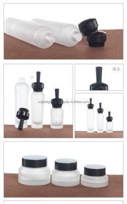 China Wholesale Empty Lotion Bottle with Pump in Frosted Glass with Black Caps