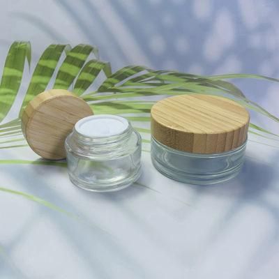 ODM 50g 100g 200g Round Bottle Glass Cosmetic Packaging Bamboo Cap Cream Jar