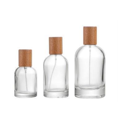 in Stocked Round 30ml 50ml 100ml Empty Glass Perfume Bottle with Plastic Metal Wood Cover