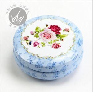 a Tin Box with a Blue Rose Design