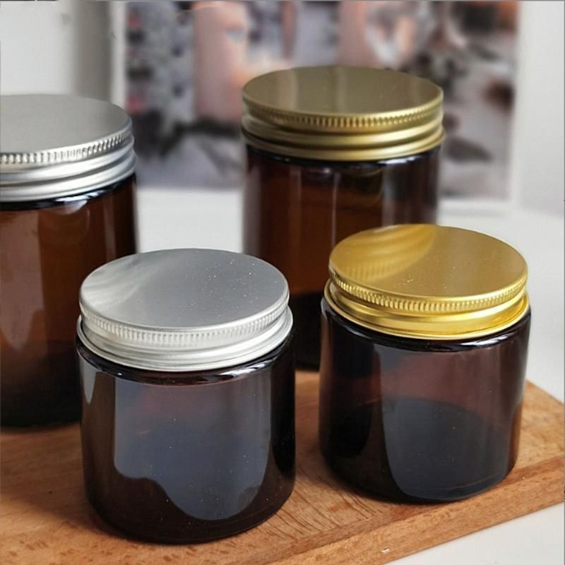 a Glass Can for Holding Candles. a Brown Glass Candlestick with a Lid