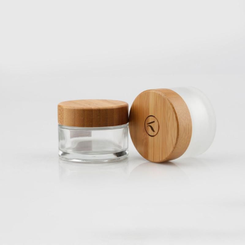 Eco Friendly Custom Logo Glass Cosmetic Jar 30g 50g Clear Frosted Glass Jars with Bamboo Wood Lid