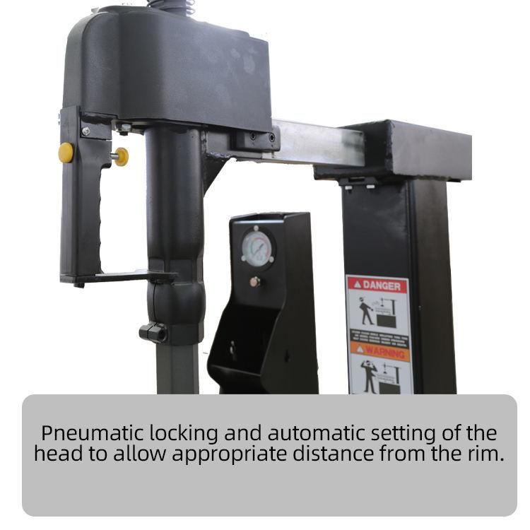 Tire Changer with Auxiliary Arm