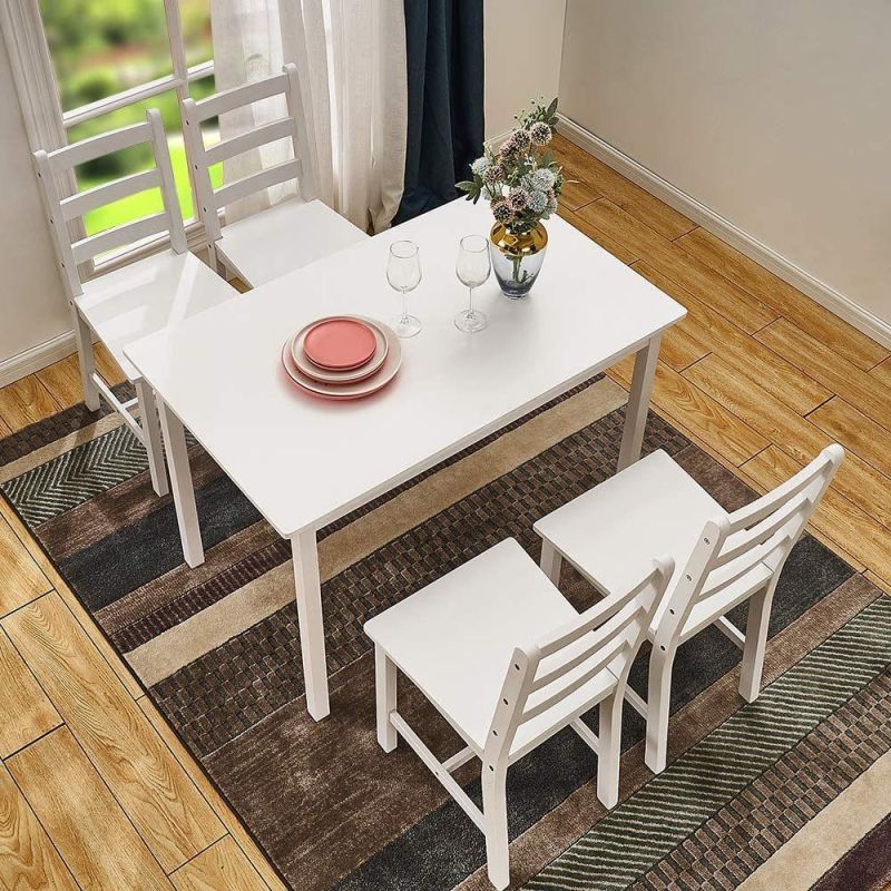 One table and four chairs in solid pine wood with white legs in natural color