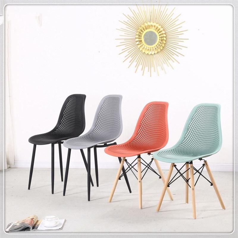 China Cheap Colored Hot Selling Plastic Emes Chairs with Wooden Legs Sillas Comedor