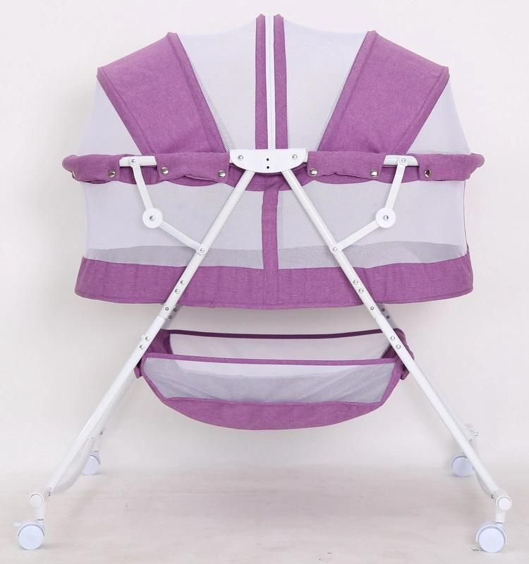 Compact Baby Bed with Canopy and Rocking Function