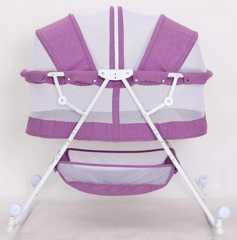 Compact Baby Bed with Canopy and Rocking Function